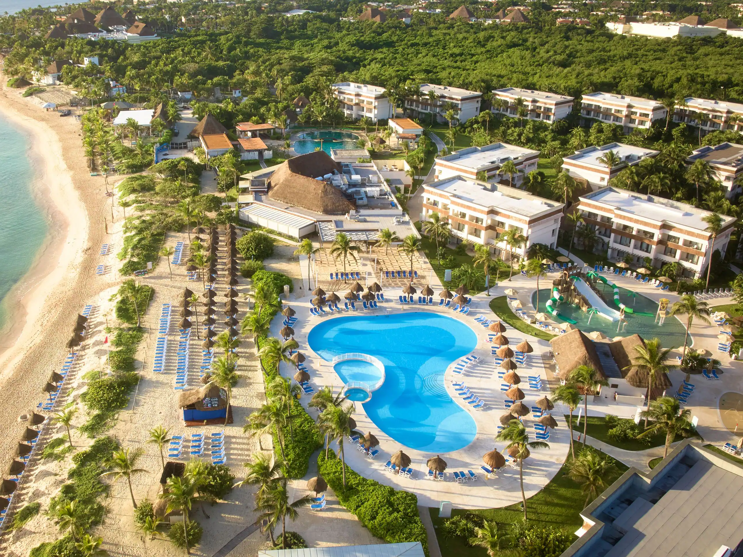 Bahia Principe Grand Tulum all-inclusive resort with expansive grounds, tropical gardens, family-friendly pools, and beachfront access near Tulum, Mexico.