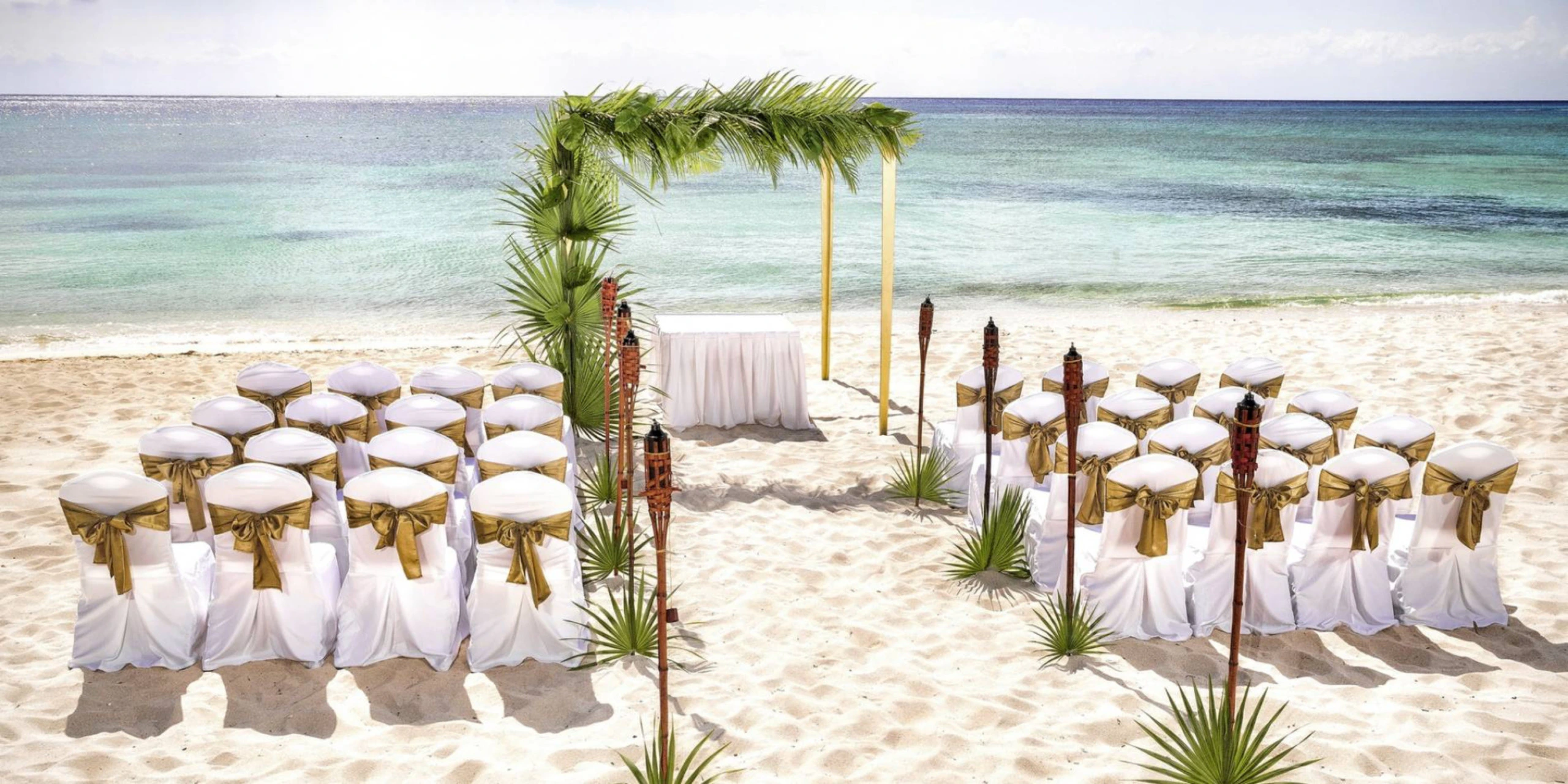 Central Beach wedding ceremony venue on the Caribbean shoreline at Secrets Tulum Resort & Beach Club