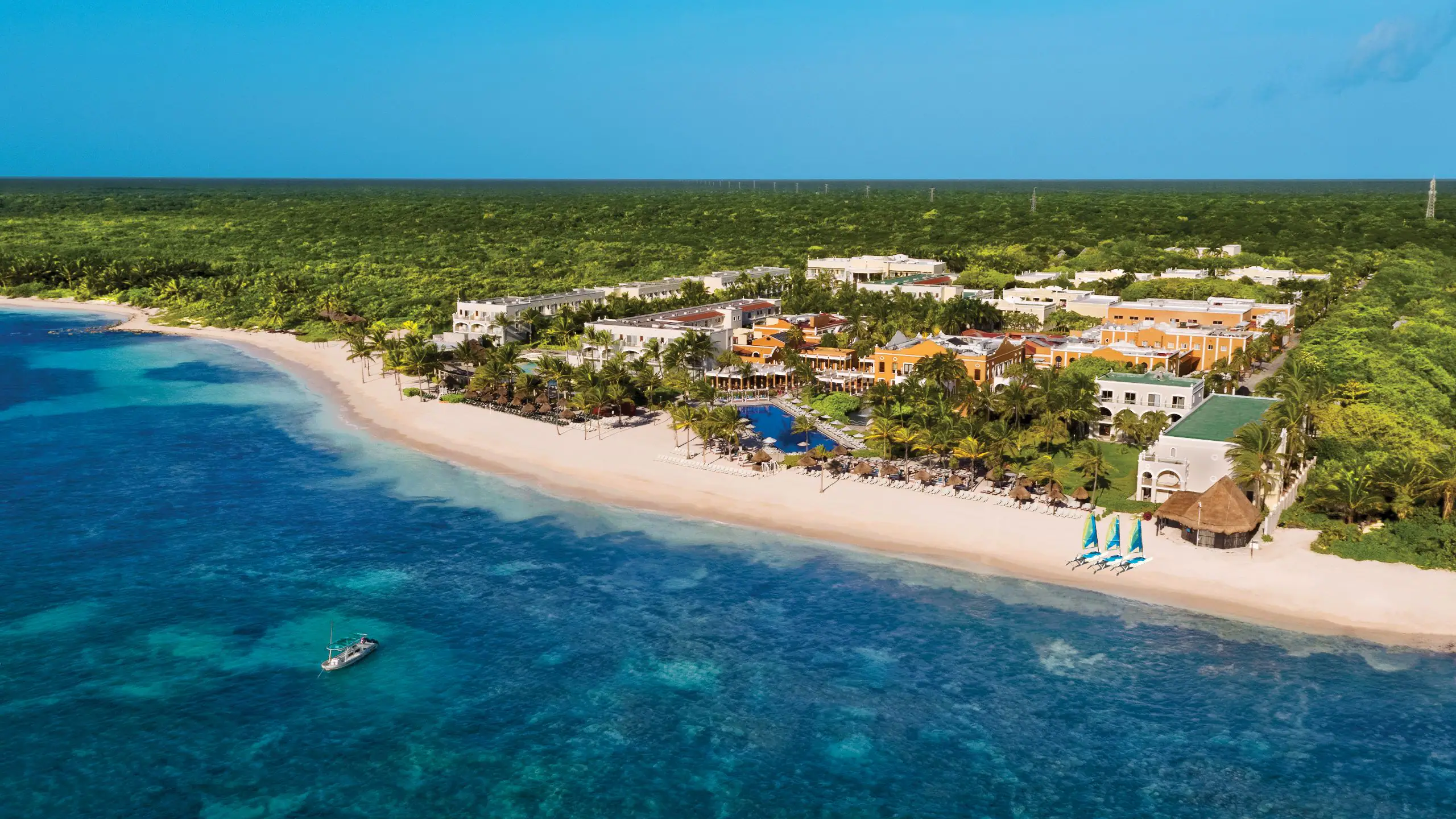 Dreams Tulum Resort and Spa family-friendly all-inclusive resort with beachfront pools, lush tropical gardens, and Mayan-inspired architecture on the Riviera Maya.