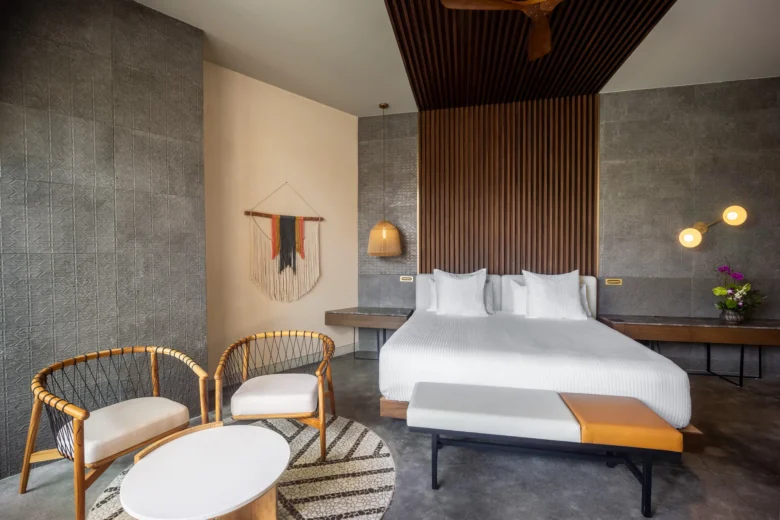 Preferred Club Junior Suite Swim Out with king bed, seating area, and modern décor at Secrets Tulum Resort & Beach Club.
